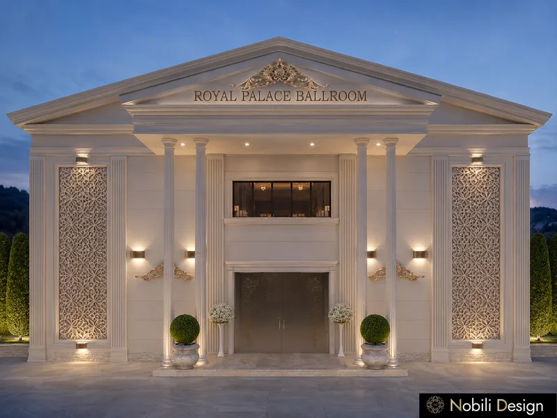 Event venue exterior design with a lit neoclassical facade, columns and a carved pediment at night