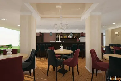 Stylish Mediterranean restaurant interior featuring light colored walls contrasting with elegant dark wooden furniture.