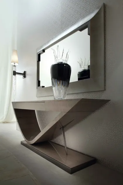 Slim Alchemy console table placed against a wall to display art and decorative living objects.